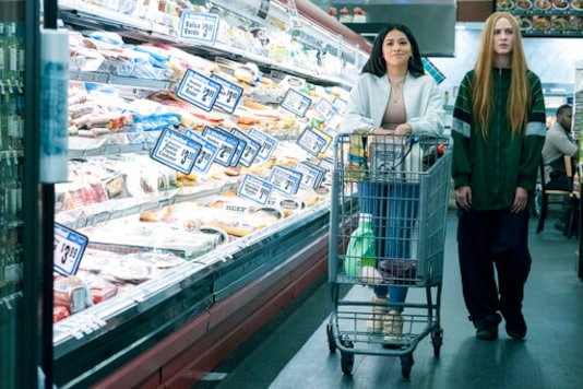 This image released by Focus Features shows Gina Rodriguez , left, and Evan Rachel Wood in a scene from This image released by Focus Features shows Gina Rodriguez , left, and Evan Rachel Wood in a scene from