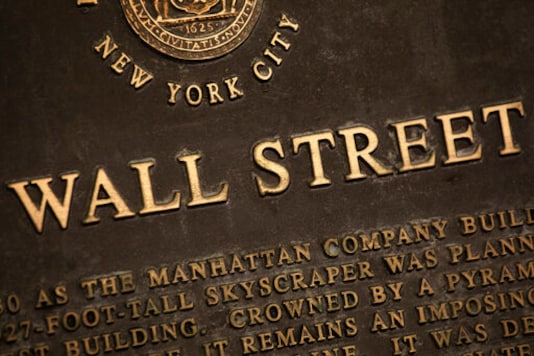 FILE - In this May 26, 2020 file photo, a historic marker for Wall Street is shown in New York's financial district. Stocks are off to a mixed start on Wall Street Tuesday, Sept. 29 as the market cooled off following a rally the day before and as investors waited for the presidential debate between former Vice President Joe Biden and President Donald Trump. Banks and industrial companies had some of the biggest losses shortly after the opening bell Tuesday, while several big technology and communications companies were higher. (AP Photo/Mark Lennihan, File) FILE - In this May 26, 2020 file photo, a historic marker for Wall Street is shown in New York's financial district. Stocks are off to a mixed start on Wall Street Tuesday, Sept. 29 as the market cooled off following a rally the day before and as investors waited for the presidential debate between former Vice President Joe Biden and President Donald Trump. Banks and industrial companies had some of the biggest losses shortly after the opening bell Tuesday, while several big technology and communications companies were higher. (AP Photo/Mark Lennihan, File)