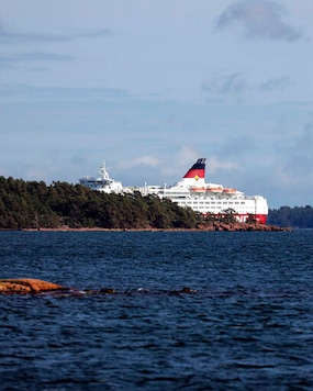 Viking Line's cruise ship M/S Amorella is seen near the Aland islands, seen from Finland, Sunday, Sept. 20, 2020. Finnish authorities say a Baltic Sea passenger ferry with nearly 300 people has run aground in the Aland Islands archipelago between Finland and Sweden without injuries. (Niclas Norlund/Lehtikuva via AP) Viking Line's cruise ship M/S Amorella is seen near the Aland islands, seen from Finland, Sunday, Sept. 20, 2020. Finnish authorities say a Baltic Sea passenger ferry with nearly 300 people has run aground in the Aland Islands archipelago between Finland and Sweden without injuries. (Niclas Norlund/Lehtikuva via AP)