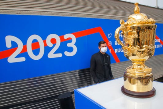 A security guard stands by the Webb Ellis Cup in Paris, Tuesday, Sept.8, 2020. The 2023 Rugby World Cup will take place in France form Sept.8 to Oct.21 2023. (AP Photo/Michel Euler) A security guard stands by the Webb Ellis Cup in Paris, Tuesday, Sept.8, 2020. The 2023 Rugby World Cup will take place in France form Sept.8 to Oct.21 2023. (AP Photo/Michel Euler)