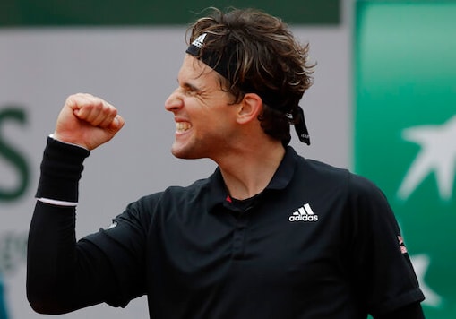 Austria's Dominic Thiem celebrates winning his second round match of the French Open tennis tournament against Jack Sock of the U.S. at the Roland Garros stadium in Paris, France, Wednesday, Sept. 30, 2020. (AP Photo/Alessandra Tarantino) Austria's Dominic Thiem celebrates winning his second round match of the French Open tennis tournament against Jack Sock of the U.S. at the Roland Garros stadium in Paris, France, Wednesday, Sept. 30, 2020. (AP Photo/Alessandra Tarantino)