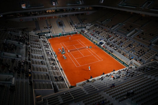 View of center court Philippe Chatrier as Belgium's David Goffin, near side, plays a shot against Italy's Jannik Sinner in the first round match of the French Open tennis tournament at the Roland Garros stadium in Paris, France, Sunday, Sept. 27, 2020. (AP Photo/Christophe Ena) View of center court Philippe Chatrier as Belgium's David Goffin, near side, plays a shot against Italy's Jannik Sinner in the first round match of the French Open tennis tournament at the Roland Garros stadium in Paris, France, Sunday, Sept. 27, 2020. (AP Photo/Christophe Ena)