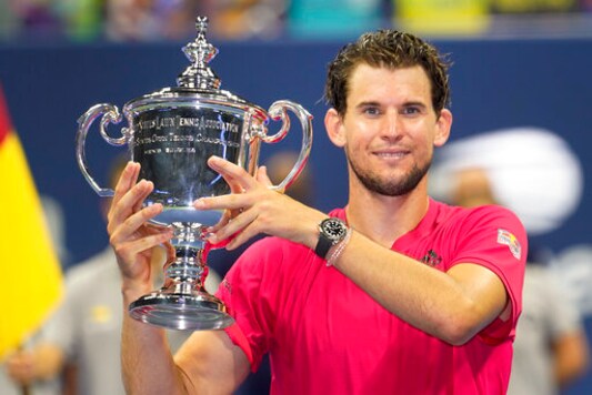 FILE - In this Sept. 13, 2020, file photo, Dominic Thiem, of Austria, holds up the championship trophy after defeating Alexander Zverev, of Germany, in the men's singles final of the U.S. Open tennis championships. in New York. After winning the U.S. Open, Thiem decided to rest at home for a bit before heading to Paris fort the French Open.(AP Photo/Frank Franklin II, File)