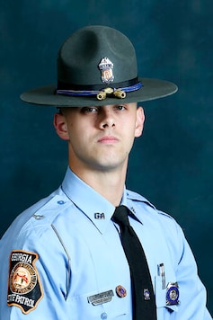 In this undated photo released by the Georgia Department of Public Safety, State trooper Jacob Gordon Thompson is seen in an official portrait. The Georgia Bureau of Investigation said in a statement Friday, Aug. 14, 2020 that Thompson was charged with felony murder and aggravated assault. The trooper has been fired and charged with murder a week after he fatally shot a 60-year-old man who attempted to flee a traffic stop. (Georgia Department of Public Safety via AP) In this undated photo released by the Georgia Department of Public Safety, State trooper Jacob Gordon Thompson is seen in an official portrait. The Georgia Bureau of Investigation said in a statement Friday, Aug. 14, 2020 that Thompson was charged with felony murder and aggravated assault. The trooper has been fired and charged with murder a week after he fatally shot a 60-year-old man who attempted to flee a traffic stop. (Georgia Department of Public Safety via AP)