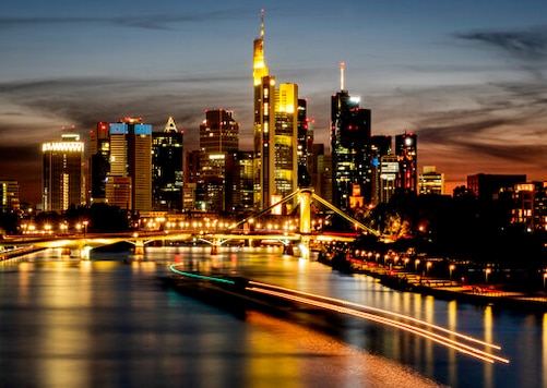 Long time exposure photo shows a cargo ship on the river Main with the buildings of the banking district in background in Frankfurt, Germany, Sunday, Sept. 20, 2020. (AP Photo/Michael Probst) Long time exposure photo shows a cargo ship on the river Main with the buildings of the banking district in background in Frankfurt, Germany, Sunday, Sept. 20, 2020. (AP Photo/Michael Probst)