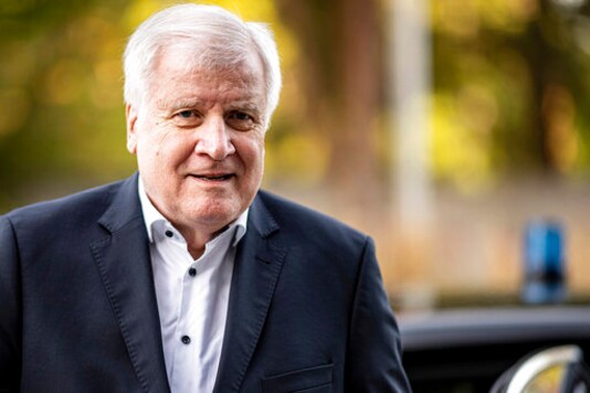 FILE-In this Sept. 19, 2020 file photo Horst Seehofer, Federal Minister of the Interior, Building and Homeland Affairs, arrives at the Kongresshotel Potsdam, Germany. German prosecutors said Friday they won't open an investigation of a newspaper column that disparaged police and infuriated the country's interior minister, finding that it was covered by the right to freedom of expression. (Fabian Sommer/dpa via AP)