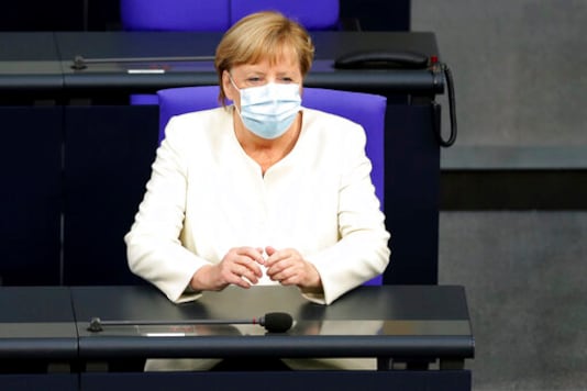 German Chancellor Angela Merkel arrives for a budget debate as part of a meeting of the German federal parliament, Bundestag, at the Reichstag building in Berlin, Germany, Tuesday, Sept. 29, 2020. (AP Photo/Michael Sohn)