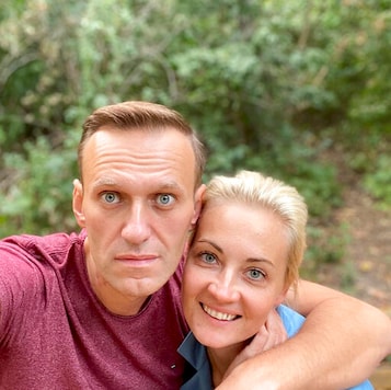 In this photo published by Russian opposition leader Alexei Navalny on his instagram account on Friday, Sept. 25, 2020, Russian opposition leader Alexei Navalny and his wife Yulia pose for a selfie in an unknown location in Germany. This week Navalny was discharged from a Berlin hospital after being treated for what German authorities determined to be nerve agent poisoning. In an Instagram post on Friday, the politician thanked Russian pilots for landing the plane after he collapsed into a coma on Aug. 20 and medics at the Omsk airport injecting him with atropine, saying they gave him 