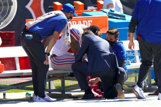 New York Giants running back Saquon Barkley is attended to on the bench by medical staff after being injured against the Chicago Bears during the first half of an NFL football game in Chicago, Sunday, Sept. 20, 2020. (AP Photo/Nam Y. Huh)