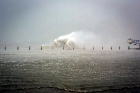Seawater from crashing waves cover a road at the port of Argostoli, on the Ionian island of Kefalonia, western Greece, Friday, Sept. 18, 2020. Hurricane-force winds and heavy rainfall battered several islands off the western coast of Greece Friday, causing power outages and road closures, as authorities in nearby mainland areas remained on alert. (AP Photo/Nikiforos Stamenis) Seawater from crashing waves cover a road at the port of Argostoli, on the Ionian island of Kefalonia, western Greece, Friday, Sept. 18, 2020. Hurricane-force winds and heavy rainfall battered several islands off the western coast of Greece Friday, causing power outages and road closures, as authorities in nearby mainland areas remained on alert. (AP Photo/Nikiforos Stamenis)