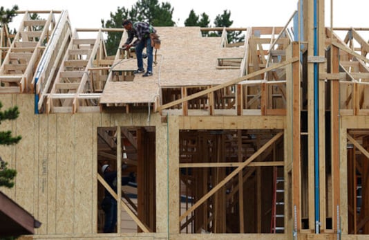 Workers toil on a multifamily dwelling Tuesday, Aug. 4, 2020, in Winter Park, Colo. The Commerce Department reported Tuesday, Aug. 18, construction of new U.S. homes surged 22.6% last month as homebuilders continued to bounce back from the coronavirus pandemic. (AP Photo/David Zalubowski) Workers toil on a multifamily dwelling Tuesday, Aug. 4, 2020, in Winter Park, Colo. The Commerce Department reported Tuesday, Aug. 18, construction of new U.S. homes surged 22.6% last month as homebuilders continued to bounce back from the coronavirus pandemic. (AP Photo/David Zalubowski)