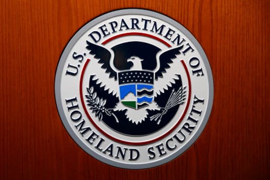 FILE - In this June 28, 2019, file photo the Department of Homeland Security (DHS) seal is seen during a news conference in Washington. An official at the Department of Homeland Security says he was pressured by agency leaders to suppress details in his intelligence reports that President Donald Trump might find objectionable, including intelligence on Russian interference in the election and the threat posed by white supremacists. (AP Photo/Carolyn Kaster, File)