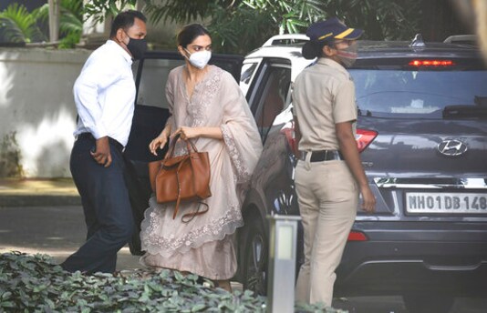 Bollywood actor, Deepika Padukone, center, arrives at the office of narcotics control board, in Mumbai, India, Saturday, Sept. 26, 2020. Bollywood star, Deepika Padukone, was questioned on Saturday by India's narcotics control board which is probing the movie industry's links with drug peddler and cartels, officials said. (AP Photo)