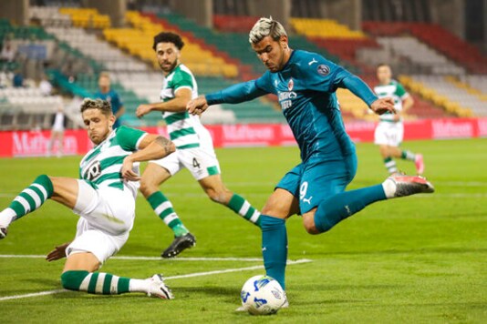 AC Milan's Theo Hernandez controls the ball during an Europa League second qualifying round soccer match between Shamrock Rovers and AC Milan at the Tallaght Stadium in Dublin, in Dublin, Thursday, Sept. 17, 2020. (AP Photo/Peter Morgan)