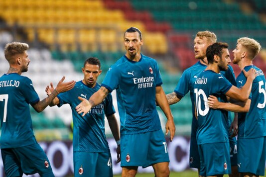 AC Milan's Zlatan Ibrahimovic, center, celebrates with his teammates after he scored his side's first goal during an Europa League second qualifying round soccer match between Shamrock Rovers and AC Milan at the Tallaght Stadium in Dublin, Thursday, Sept. 17, 2020. (AP Photo/Peter Morgan)