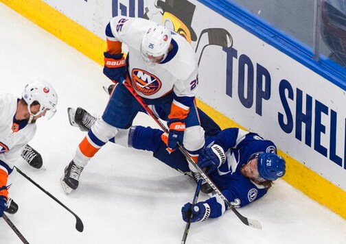 Tampa Bay Lightning center Blake Coleman (20) is checked by New York Islanders defenseman Devon Toews (25) during the second period of Game 5 of the NHL hockey Eastern Conference final, Tuesday, Sept. 15, 2020, in Edmonton, Alberta. (Jason Franson/The Canadian Press via AP)
