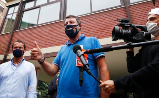 Right-wing opposition leader Matteo Salvini leaves a polling station, in Milan, Italy, Monday, Sept. 21, 2020. On Sunday and Monday Italians are called to vote nationwide in a referendum to confirm a historical change to the country's constitution to drastically reduce the number of Members of Parliament from 945 to 600. Eighteen million of Italian citizens will also vote on Sunday and Monday to renew local governors in seven regions, along with mayors in approximately 1,000 cities. (AP Photo/Antonio Calanni)