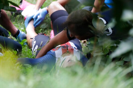 United States' Chloe Dygert gets medical assistance after falling down during the women's Individual Time Trial event, at the road cycling World Championships, in Imola, Italy, Thursday, Sept. 24, 2020. (AP Photo/Andrew Medichini)