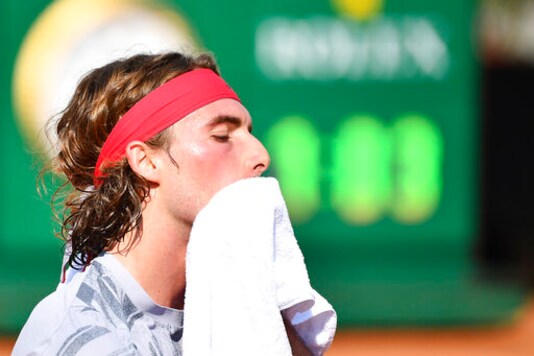 Greece's Stefanos Tsitsipas wipes his face during his match with Italy's Jannik Sinner, at the Italian Open tennis tournament in Rome, Wednesday, Sept. 16, 2020. (Alfredo Falcone/LaPresse via AP)