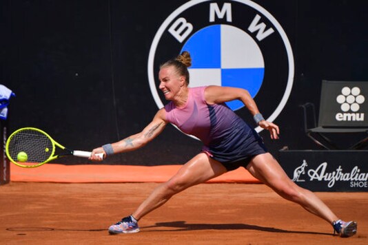 Russia's Svetlana Kuznetsova returns the ball to Estonia's Anett Kontaveit during their Italian Open tennis tournament match, in Rome, Thursday, Sept. 17, 2020. (Alfredo Falcone/LaPresse via AP)