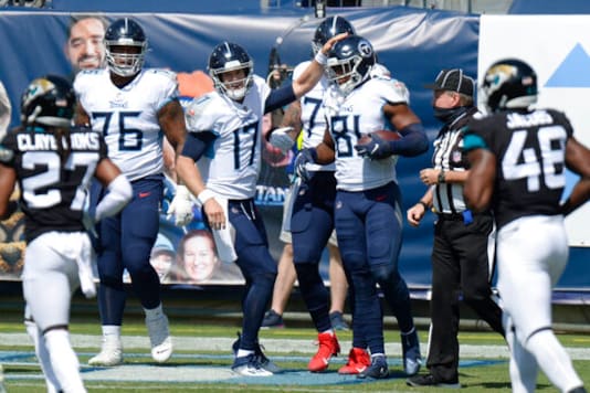 Tennessee Titans quarterback Ryan Tannehill (17) congratulates tight end Jonnu Smith (81) after the two teamed up for a 13-yard touchdown pass against the Jacksonville Jaguars in the first half of an NFL football game Sunday, Sept. 20, 2020, in Nashville, Tenn. (AP Photo/Mark Zaleski) Tennessee Titans quarterback Ryan Tannehill (17) congratulates tight end Jonnu Smith (81) after the two teamed up for a 13-yard touchdown pass against the Jacksonville Jaguars in the first half of an NFL football game Sunday, Sept. 20, 2020, in Nashville, Tenn. (AP Photo/Mark Zaleski)