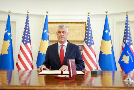 Kosovo's President Hashim Thaci signs the Order of Freedom awarded to U.S President Donald Trump, in capital Pristina, Kosovo on Friday, Sept. 18, 2020. Kosovo's president awarded U.S. President Donald Trump with one of the country's highest medals - Kosovo's Order of Freedom - for his government's efforts on peace and reconciliation in the former war-torn region. (AP Photo/Visar Kryeziu)