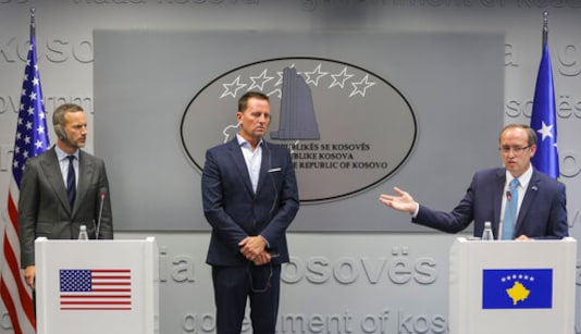 Kosovo prime minister Avdullah Hoti, right, joined by U.S. presidential envoy for the Kosovo-Serbia talks Richard Grenell, center, head of U.S. International Development Finance Corporation Adam Boehler, left, during a press conference by head of U.S. International Development Finance Corporation Adam Boehler, in capital Pristina, Kosovo on Monday, Sept. 21, 2020. A high-level delegation from the Untied States visited Kosovo on Monday to discuss on how to move ahead with projects signed earlier at a White House meeting between Kosovo and Serbia to nromalzie their economic ties. (AP Photo/Visar Kryeziu) Kosovo prime minister Avdullah Hoti, right, joined by U.S. presidential envoy for the Kosovo-Serbia talks Richard Grenell, center, head of U.S. International Development Finance Corporation Adam Boehler, left, during a press conference by head of U.S. International Development Finance Corporation Adam Boehler, in capital Pristina, Kosovo on Monday, Sept. 21, 2020. A high-level delegation from the Untied States visited Kosovo on Monday to discuss on how to move ahead with projects signed earlier at a White House meeting between Kosovo and Serbia to nromalzie their economic ties. (AP Photo/Visar Kryeziu)