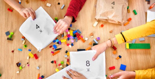 In an image provided by Lego, colorful toy Lego bricks are seen. Lego said Tuesday, Sept. 15, 2020, that it will stop using plastic bags inside its boxed sets and replace them with paper ones. (Allan Ringgaard/Courtesy of Lego via AP)