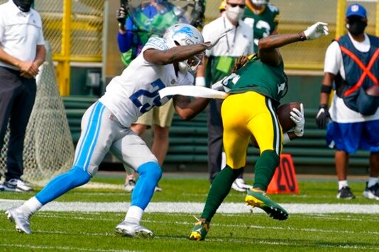 Detroit Lions' Will Harris is called for a horsecollar penalty on his tackle of Green Bay Packers' Davante Adams during the first half of an NFL football game Sunday, Sept. 20, 2020, in Green Bay, Wis. (AP Photo/Morry Gash)