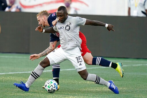 Montreal Impact's Zachary Brault-Guillard, right, and New England Revolution's Alexander Buttner, left, vie for control of the ball during the first half of an MLS soccer match, Wednesday, Sept. 23, 2020, in Foxborough, Mass. (AP Photo/Steven Senne)