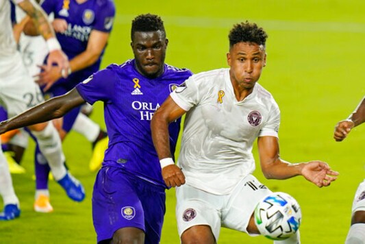 Orlando City forward Daryl Dike, left, and Inter Miami's Juan Agudelo battle for possession of the ball off a corner kick during the first half of an MLS soccer match, Saturday, Sept. 12, 2020, in Orlando, Fla. (AP Photo/John Raoux)