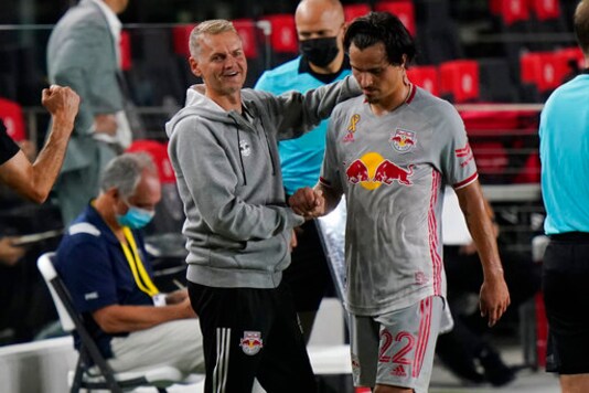 New York Red Bulls interim head coach Bradley Carnell, left, greets midfielder Florian Valot, right, as he comes off the field during the second half of an MLS soccer match against Inter Miami, Wednesday, Sept. 23, 2020, in Fort Lauderdale, Fla. (AP Photo/Lynne Sladky) New York Red Bulls interim head coach Bradley Carnell, left, greets midfielder Florian Valot, right, as he comes off the field during the second half of an MLS soccer match against Inter Miami, Wednesday, Sept. 23, 2020, in Fort Lauderdale, Fla. (AP Photo/Lynne Sladky)