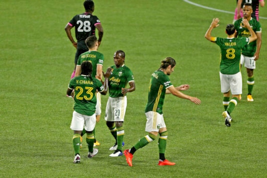 Portland Timbers' Yimmi Chara (23) is congratulated for his goal against the Seattle Sounders during the first half of an MLS soccer match Wednesday, Sept. 23, 2020, in Portland, Ore. (Sean Meagher/The Oregonian via AP) Portland Timbers' Yimmi Chara (23) is congratulated for his goal against the Seattle Sounders during the first half of an MLS soccer match Wednesday, Sept. 23, 2020, in Portland, Ore. (Sean Meagher/The Oregonian via AP)