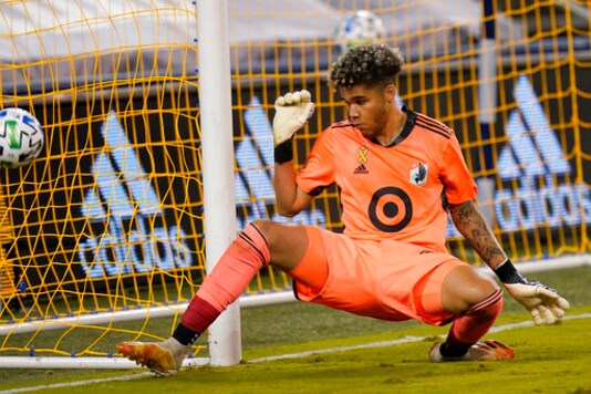 Minnesota United goalkeeper Dayne St. Clair defends the post during the first half of an MLS soccer match against Sporting Kansas City in Kansas City, Kan., Sunday, Sept. 13, 2020. (AP Photo/Orlin Wagner)