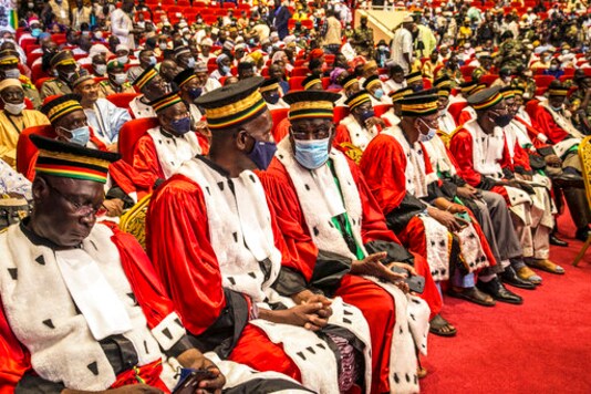 Delegates attend a ceremony to swear in the transitional president and vice president in the capital Bamako, Mali, Friday, Sept. 25, 2020. Mali's transitional president and vice president were sworn into office Friday, more than a month after a coup in the West African nation, as Mali remains under sanctions by the 15-nation West African regional bloc ECOWAS, and amid uncertainty about details of the transition period. (AP Photo)