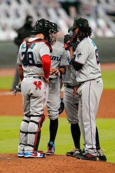 Miami Marlins starting pitcher Jose Urena, right, and Miami Marlins catcher Jorge Alfaro, left, and other players gather on the mound in the fifth inning of a baseball game against the Atlanta Braves on Tuesday, Sept. 22, 2020, in Atlanta. (AP Photo/Brynn Anderson) Miami Marlins starting pitcher Jose Urena, right, and Miami Marlins catcher Jorge Alfaro, left, and other players gather on the mound in the fifth inning of a baseball game against the Atlanta Braves on Tuesday, Sept. 22, 2020, in Atlanta. (AP Photo/Brynn Anderson)