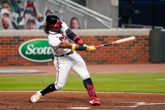 Atlanta Braves' Ronald Acuna Jr., strikes out in the fourth inning of a baseball game against the Miami Marlins on Tuesday, Sept. 22, 2020, in Atlanta. (AP Photo/Brynn Anderson)