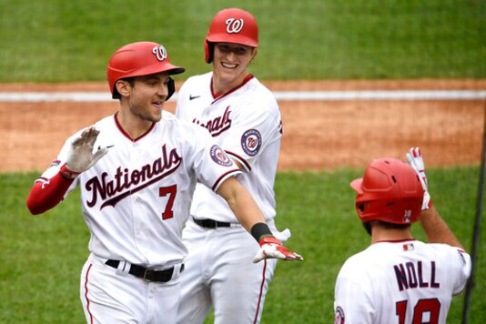 Washington Nationals' Trea Turner (7) celebrates his grand slam with Andrew Stevenson, center, and Jake Noll, right, during the third inning of a baseball game against the New York Mets, Sunday, Sept. 27, 2020, in Washington. (AP Photo/Nick Wass) Washington Nationals' Trea Turner (7) celebrates his grand slam with Andrew Stevenson, center, and Jake Noll, right, during the third inning of a baseball game against the New York Mets, Sunday, Sept. 27, 2020, in Washington. (AP Photo/Nick Wass)