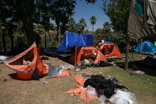 Tents and belongings lay scattered on the ground a day after farmers ousted National Guard troops from La Boquilla Dam in order to close the dam's valves and reduce the flow of water toward the United States, in Chihuahua State, Wednesday, Sept. 9, 2020. Tuesday's clash between hundreds of farmers and National Guard troops was the latest flashpoint in a months-long conflict over the Mexican government's attempts to pay off its water debt with the United States over objections of local farmers. (AP Photo/Christian Chavez) Tents and belongings lay scattered on the ground a day after farmers ousted National Guard troops from La Boquilla Dam in order to close the dam's valves and reduce the flow of water toward the United States, in Chihuahua State, Wednesday, Sept. 9, 2020. Tuesday's clash between hundreds of farmers and National Guard troops was the latest flashpoint in a months-long conflict over the Mexican government's attempts to pay off its water debt with the United States over objections of local farmers. (AP Photo/Christian Chavez)
