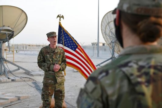 In this photo released by the U.S. Air Force, Col. Todd Benson, the U.S. Air Force Central Command director of space forces, addresses members of the 379th Operations Support Squadron before they are sworn in as members of the Space Force at Al-Udeid Air Base, Qatar, Tuesday, Sept. 1, 2020. Space Force, the first new U.S. military service since the creation of the Air Force in 1947, now has some 20 members stationed at the Qatari base in its first foreign deployment. (Staff Sgt. Kayla White/U.S. Air Force via AP) In this photo released by the U.S. Air Force, Col. Todd Benson, the U.S. Air Force Central Command director of space forces, addresses members of the 379th Operations Support Squadron before they are sworn in as members of the Space Force at Al-Udeid Air Base, Qatar, Tuesday, Sept. 1, 2020. Space Force, the first new U.S. military service since the creation of the Air Force in 1947, now has some 20 members stationed at the Qatari base in its first foreign deployment. (Staff Sgt. Kayla White/U.S. Air Force via AP)