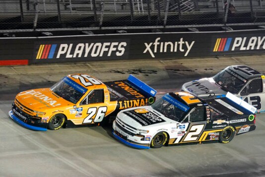 Tyler Ankrum (26) and Sheldon Creed (2) drive into Turn Four during a NASCAR Truck Series auto race Thursday Sept. 17, 2020, in Bristol, Tenn. (AP Photo/Steve Helber)
