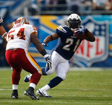 FILE - In this Sunday, Jan. 3, 2010 file photo, San Diego Chargers running back LaDainian Tomlinson during the first quarter of an NFL football game in San Diego. After shutting down receivers during his Hall of Fame career, Aeneas Williams, the former Cardinals and Rams defensive back, hosts the NFL Legends podcast, a platform for former players to share their stories, encourage each other and learn about programs available to them. Tomlinson was a guest on the podcast last month. He talked to Williams about his charity foundation and his commitment to social justice issues. (AP Photo/Lenny Ignelzi, File) FILE - In this Sunday, Jan. 3, 2010 file photo, San Diego Chargers running back LaDainian Tomlinson during the first quarter of an NFL football game in San Diego. After shutting down receivers during his Hall of Fame career, Aeneas Williams, the former Cardinals and Rams defensive back, hosts the NFL Legends podcast, a platform for former players to share their stories, encourage each other and learn about programs available to them. Tomlinson was a guest on the podcast last month. He talked to Williams about his charity foundation and his commitment to social justice issues. (AP Photo/Lenny Ignelzi, File)