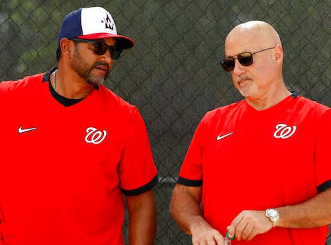 FILE - In this Feb. 17, 2020, file photo, Washington Nationals manager Dave Martinez, left, talks with general manager Mike Rizzo during spring training baseball practice in West Palm Beach, Fla. Armed with a new multiyear contract, Rizzo says his top priority is working on a new deal for Martinez. The team has a club option for Martinez for 2021, but Rizzo says he prefers a long-term deal for the manager. (AP Photo/Jeff Roberson, File) FILE - In this Feb. 17, 2020, file photo, Washington Nationals manager Dave Martinez, left, talks with general manager Mike Rizzo during spring training baseball practice in West Palm Beach, Fla. Armed with a new multiyear contract, Rizzo says his top priority is working on a new deal for Martinez. The team has a club option for Martinez for 2021, but Rizzo says he prefers a long-term deal for the manager. (AP Photo/Jeff Roberson, File)