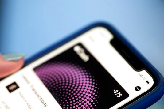 FILE - This Oct. 8, 2019 file photo shows the Apple Pay app on an iPhone in New York. Using contactless payments for in-person retail transactions offers convenience and security benefits, but amid the coronavirus pandemic, hygiene might be the best reason yet. Contactless usually means tap-to-pay credit and debit cards, smartphone digital wallets or retailer apps. (AP Photo/Jenny Kane, File) FILE - This Oct. 8, 2019 file photo shows the Apple Pay app on an iPhone in New York. Using contactless payments for in-person retail transactions offers convenience and security benefits, but amid the coronavirus pandemic, hygiene might be the best reason yet. Contactless usually means tap-to-pay credit and debit cards, smartphone digital wallets or retailer apps. (AP Photo/Jenny Kane, File)