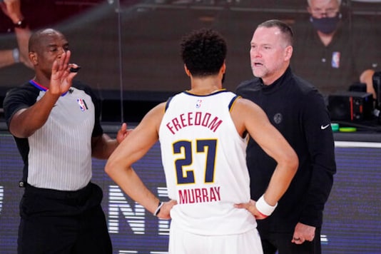 Denver Nuggets head coach Michael Malone talks with Denver Nuggets' Jamal Murray (27) during the second half of an NBA conference final playoff basketball game against the Los Angeles Lakers Saturday, Sept. 26, 2020, in Lake Buena Vista, Fla. (AP Photo/Mark J. Terrill) Denver Nuggets head coach Michael Malone talks with Denver Nuggets' Jamal Murray (27) during the second half of an NBA conference final playoff basketball game against the Los Angeles Lakers Saturday, Sept. 26, 2020, in Lake Buena Vista, Fla. (AP Photo/Mark J. Terrill)