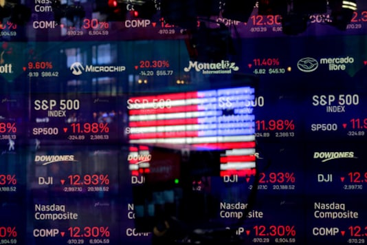 FILE - In this March 16, 2020 file photo, a United States flag is reflected in the window of the Nasdaq studio in Times Square, New York. Companies that cater to the new normal of working and shopping from home are rushing to go public. 2020 could shape up to be both a dismal year for economic growth and the best year for the IPO market in two decades.
(AP Photo/Seth Wenig, File) FILE - In this March 16, 2020 file photo, a United States flag is reflected in the window of the Nasdaq studio in Times Square, New York. Companies that cater to the new normal of working and shopping from home are rushing to go public. 2020 could shape up to be both a dismal year for economic growth and the best year for the IPO market in two decades.
(AP Photo/Seth Wenig, File)