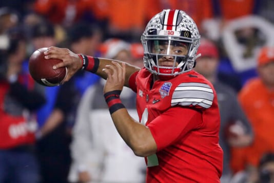 FILE - In this Dec. 28, 2019, file photo, Ohio State quarterback Justin Fields throws a pass against Clemson during the first half of the Fiesta Bowl NCAA college football playoff semifinal in Glendale, Ariz. When Fields got together with some of his teammates last Saturday to watch college football on TV, the mood was dark. Distraught, Fields said. (AP Photo/Rick Scuteri, File) FILE - In this Dec. 28, 2019, file photo, Ohio State quarterback Justin Fields throws a pass against Clemson during the first half of the Fiesta Bowl NCAA college football playoff semifinal in Glendale, Ariz. When Fields got together with some of his teammates last Saturday to watch college football on TV, the mood was dark. Distraught, Fields said. (AP Photo/Rick Scuteri, File)