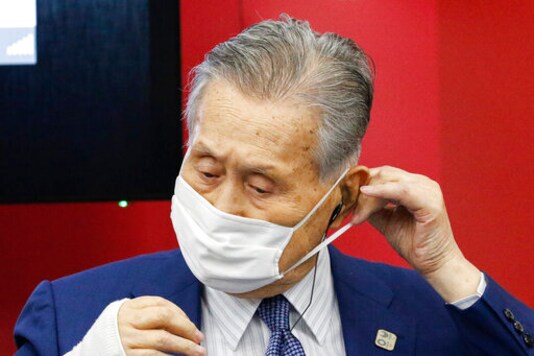 President of Tokyo 2020 Yoshiro Mori wears a face mask before he leaves a joint press conference between the International Olympic Committee (IOC) and Tokyo Organizing Committee of the Olympic and Paralympic Games (Tokyo 2020) Friday, Sept. 25, 2020, in Tokyo. (Rodrigo Reyes Marin/Pool Photo via AP)