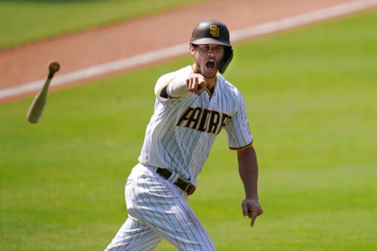 FILE - In this Aug. 27, 2020 file photo, the San Diego Padres' Wil Myers reacts after hitting a three-run walkoff home run to defeat the Seattle Mariners in a baseball game in San Diego. Wil Myers is back. While Manny Machado and Fernando Tatis Jr. have grabbed most of the attention on the playoff-bound Padres, Myers' comeback performance has also been instrumental in returning San Diego to postseason play for the first time since 2006. Myers is hitting .291 with 14 homers and 38 RBIs in 52 games. (AP Photo/Gregory Bull, File) FILE - In this Aug. 27, 2020 file photo, the San Diego Padres' Wil Myers reacts after hitting a three-run walkoff home run to defeat the Seattle Mariners in a baseball game in San Diego. Wil Myers is back. While Manny Machado and Fernando Tatis Jr. have grabbed most of the attention on the playoff-bound Padres, Myers' comeback performance has also been instrumental in returning San Diego to postseason play for the first time since 2006. Myers is hitting .291 with 14 homers and 38 RBIs in 52 games. (AP Photo/Gregory Bull, File)