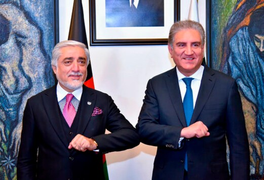 In this photo provided by Pakistan's Ministry of Foreign Affairs, Abdullah Abdullah, left, chairman of Afghanistan's High Council for National Reconciliation, bumps elbows with Pakistani Foreign Minister Shah Mahmood Qureshi, upon for a meeting, in Islamabad, Pakistan, Monday, Sept. 28, 2020. Afghanistan's top official in negotiations with the Taliban arrived in Pakistan's capital Monday on a three-day trip during which he will meet with the country's prime minister and other government officials. (Ministry of Foreign Affairs via AP) In this photo provided by Pakistan's Ministry of Foreign Affairs, Abdullah Abdullah, left, chairman of Afghanistan's High Council for National Reconciliation, bumps elbows with Pakistani Foreign Minister Shah Mahmood Qureshi, upon for a meeting, in Islamabad, Pakistan, Monday, Sept. 28, 2020. Afghanistan's top official in negotiations with the Taliban arrived in Pakistan's capital Monday on a three-day trip during which he will meet with the country's prime minister and other government officials. (Ministry of Foreign Affairs via AP)